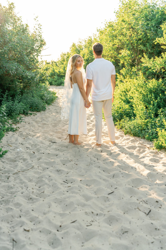 Bride and Groom holding hands at their Cape May Beach Wedding