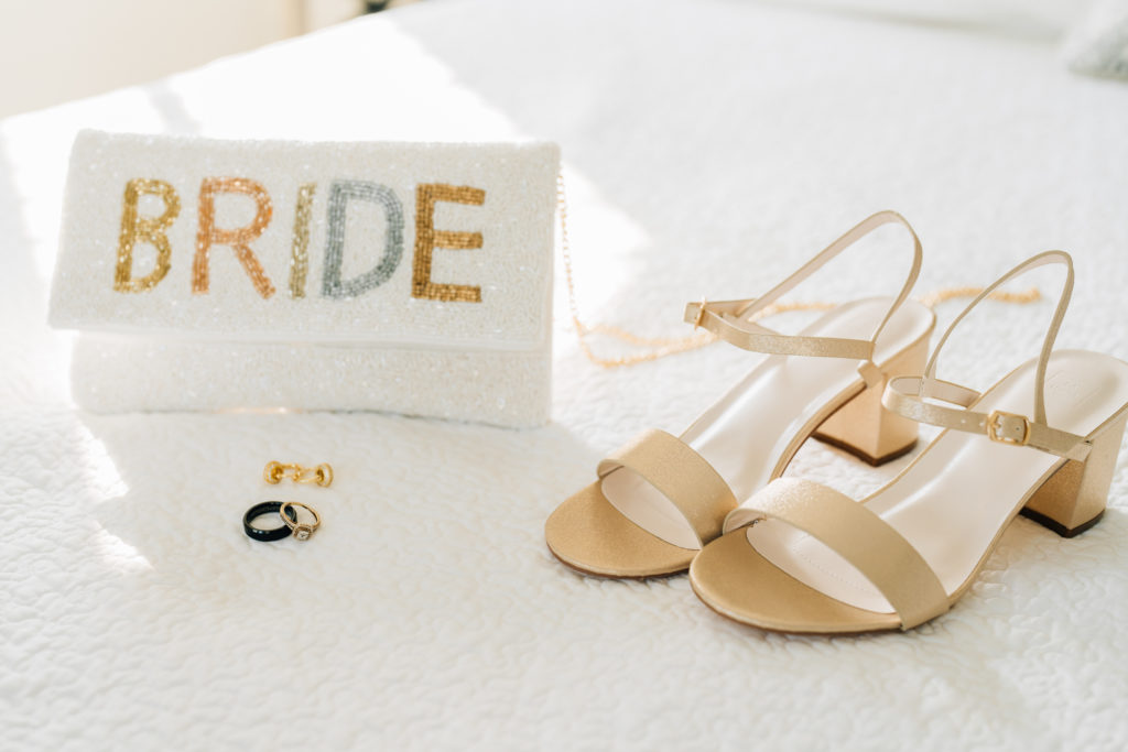 Bride details - clutch, rings, shoes, earrings