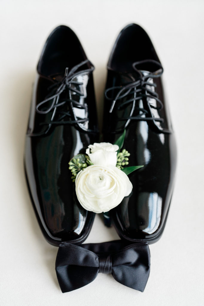 Groom shoes, bowtie and boutonniere