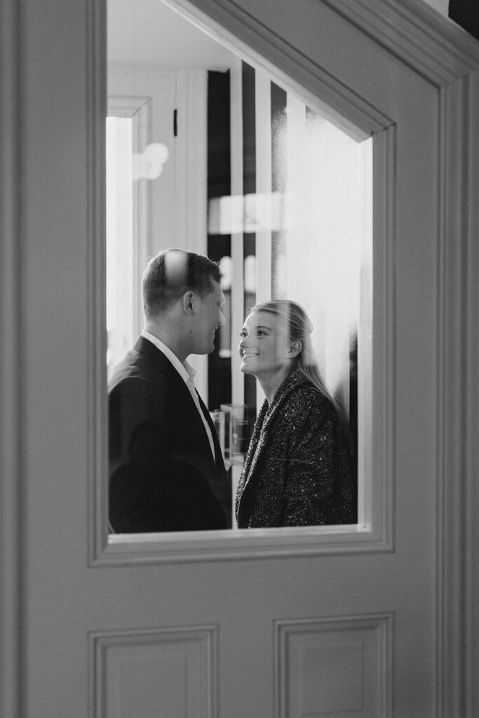 Newly engaged couple in the vestibule of Congress Hall in Cape May, New Jersey for their charming engagement session