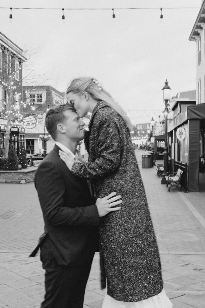 Newly engaged couple walking on the Washington Street Mall in Cape May, New Jersey