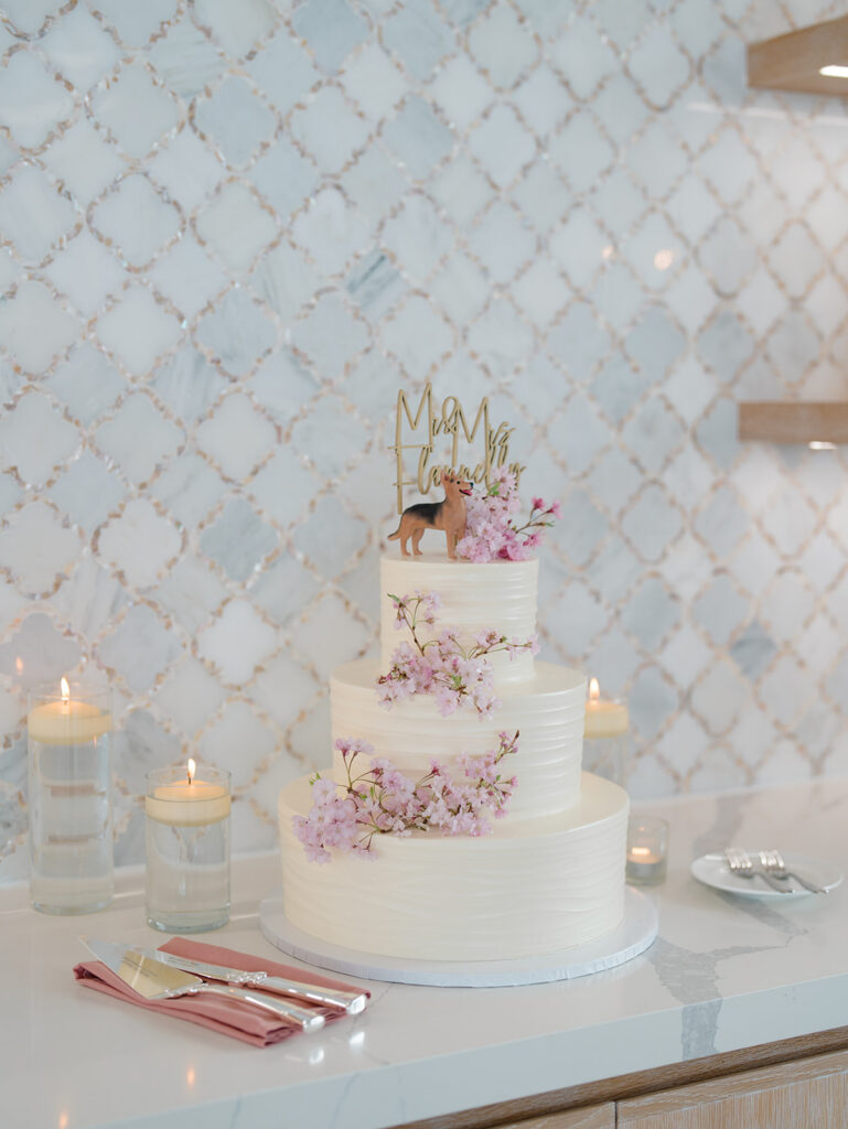 Wedding cake by Bake Works displayed at an Icona Diamond Beach reception