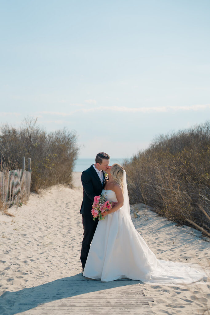 Bride and groom portraits on the beach in Cape May, NJ after their spring wedding ceremony
