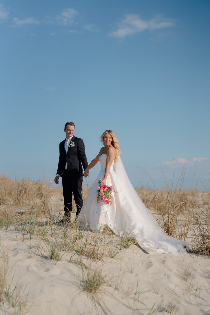 April wedding day at Icona Diamond Beach under blue skies and soft white clouds