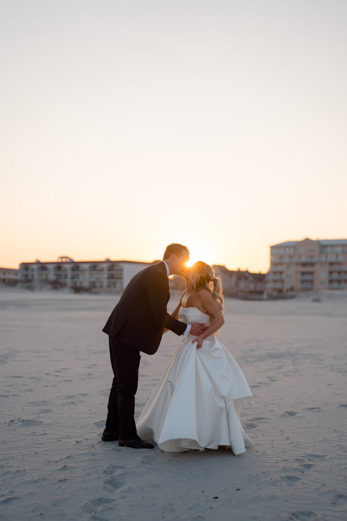 Golden hour bride and groom portraits outside Icona Diamond Beach on the Jersey Shore